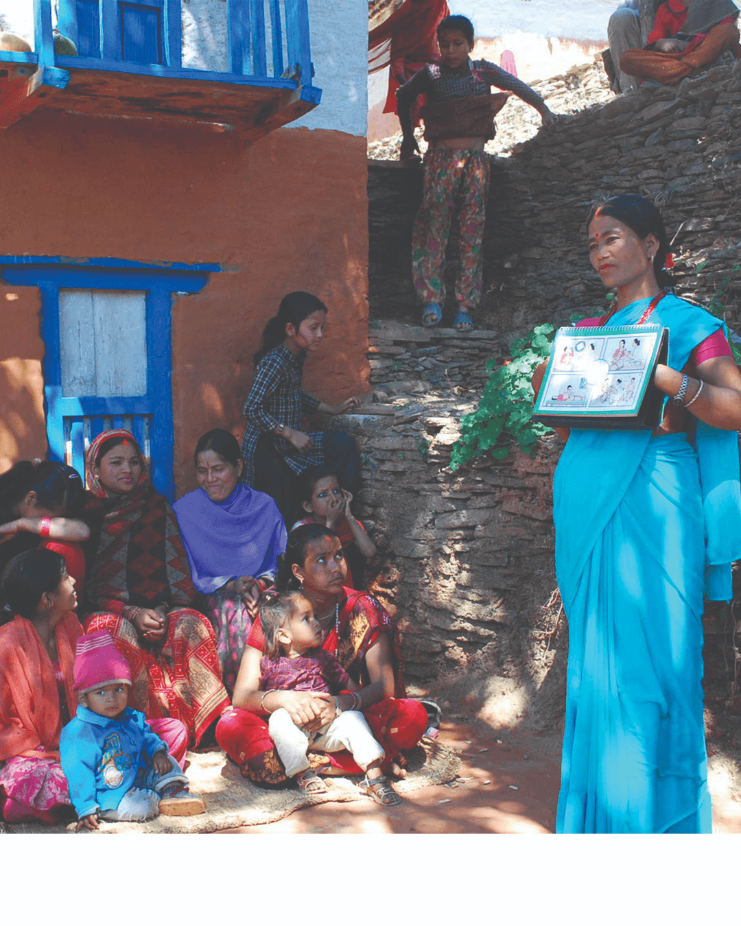 Health worker providing community education and support to a patient